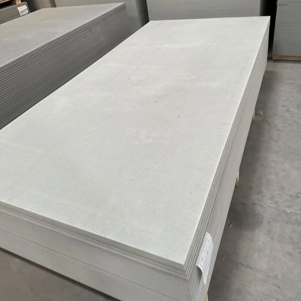 Middle density fiber cement building boards
